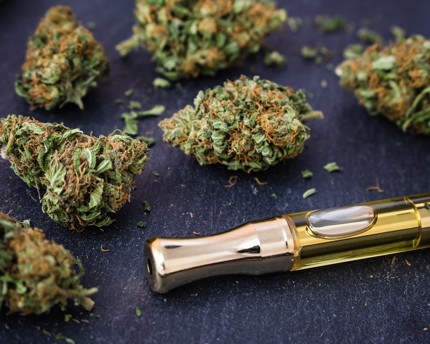 Marijuana buds with a THC oil extracted filled cartridge